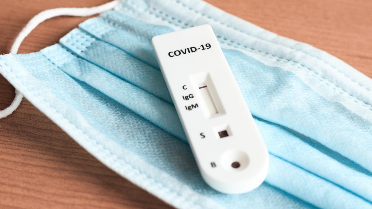 Close-up view  of covid-19 IgG/IgM rapid test  casette  indicating a negative infection .