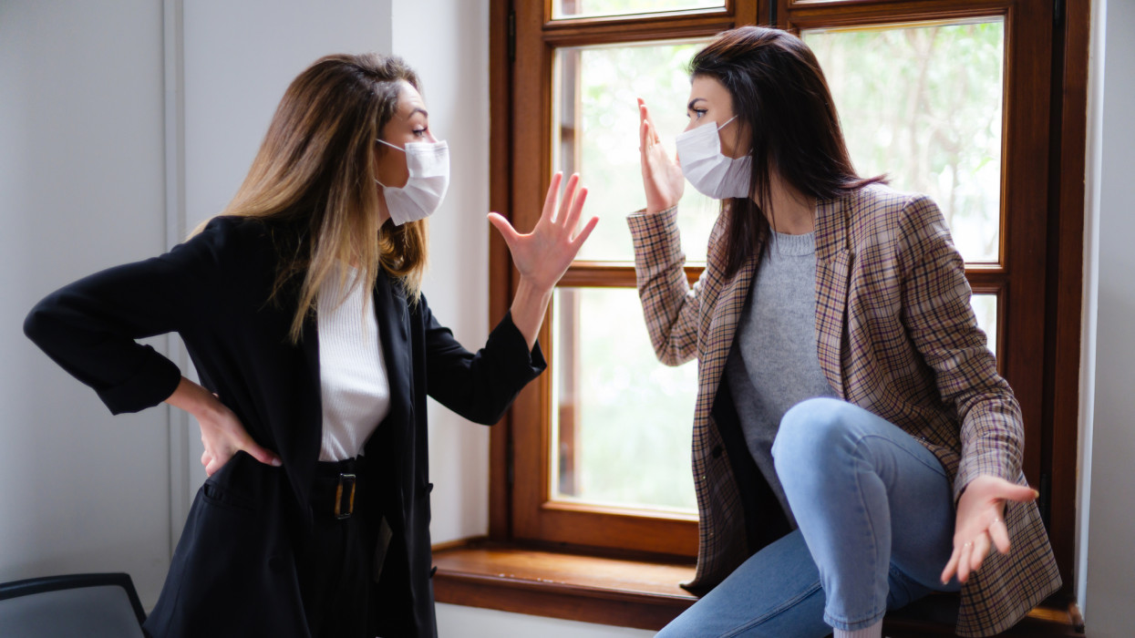 Two Young Entrepreneur Woman With Protective Face Mask Arguing In The Office