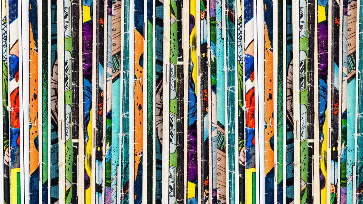 Stack of old vintage comic books background texture pattern