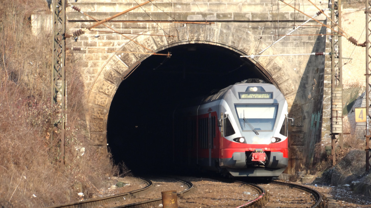 The shot depicts train as a passenger transport vehicle under power. The shot was taken in Europe, Hungary, Budapest city.