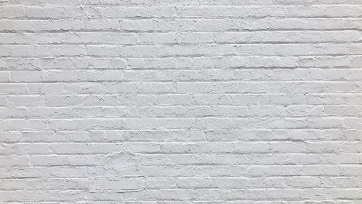 Full frame of a brick wall painted white