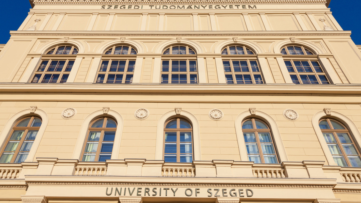Picture of the University of Szeged, on Dugonics square, during a warm summer afternoon. The University of Szeged, or Szegedi Tudomanyegyetem, is a research university in Hungary located in the countrys third largest city, Szeged, in Csongrad County in the Southern Great Plain