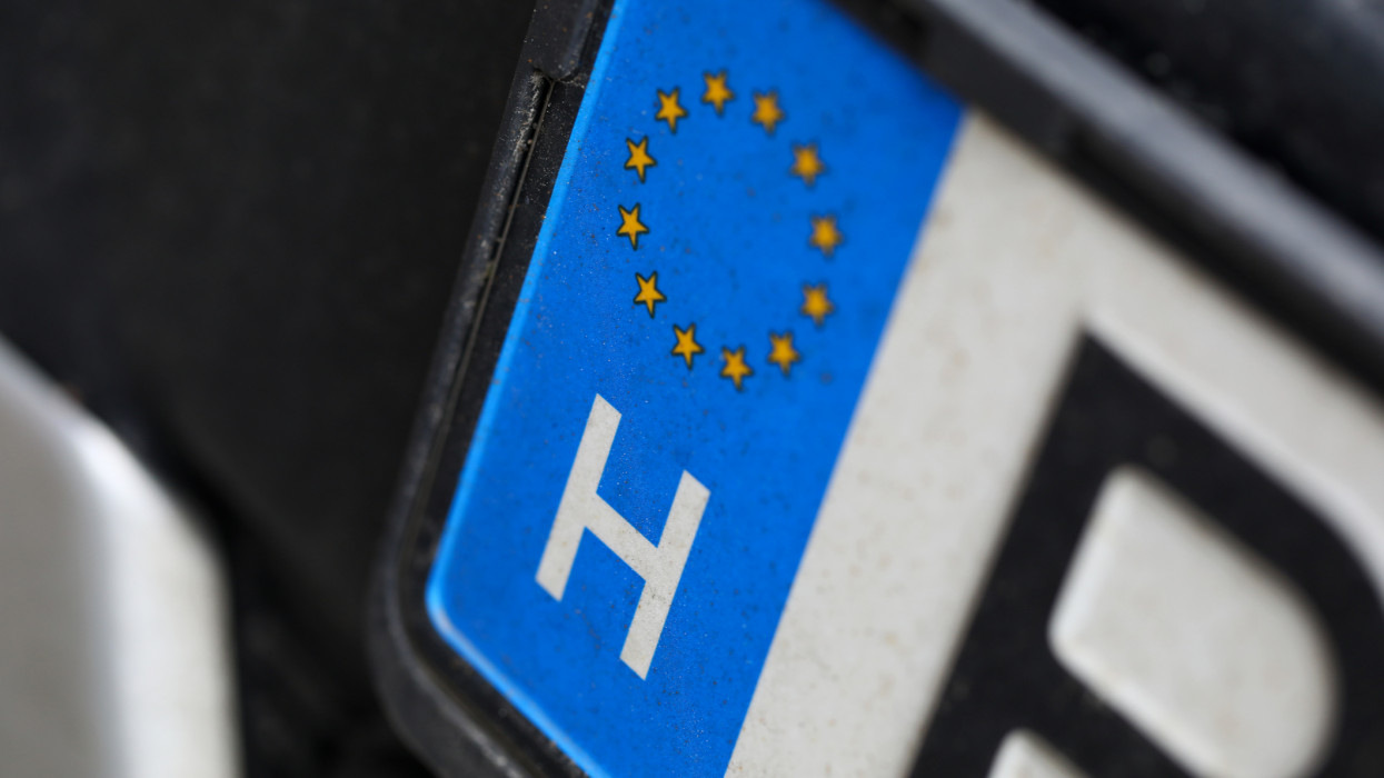 Close-up of car european license plate. Automobile from eu. Macro shot of registration number from european union. Small stars placed in circle. Vehicle and transport concept