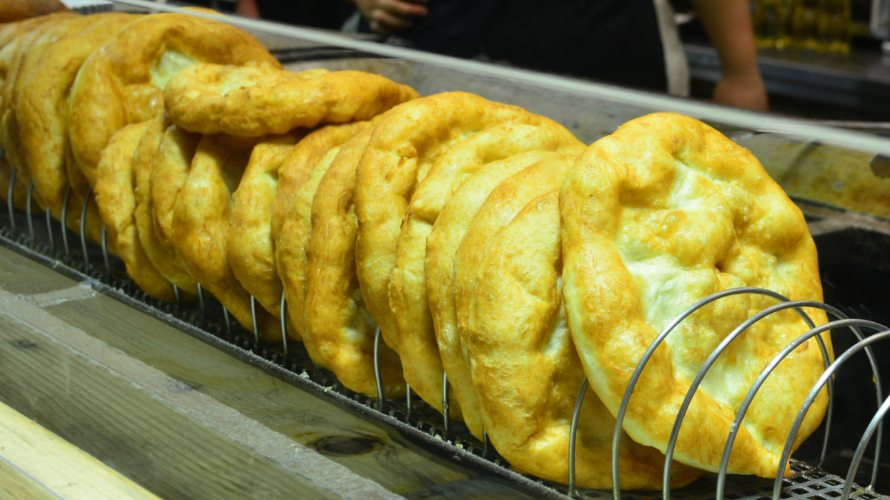 Street food at the Budapest market, traditional Hungarian langos bread