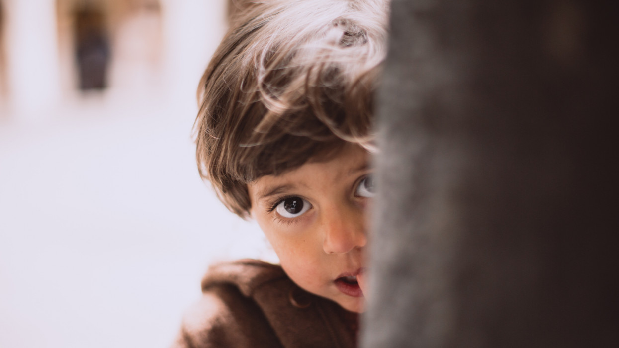 Portrait of Armenian boy witn beautiful brown eyes in toddler age close up.