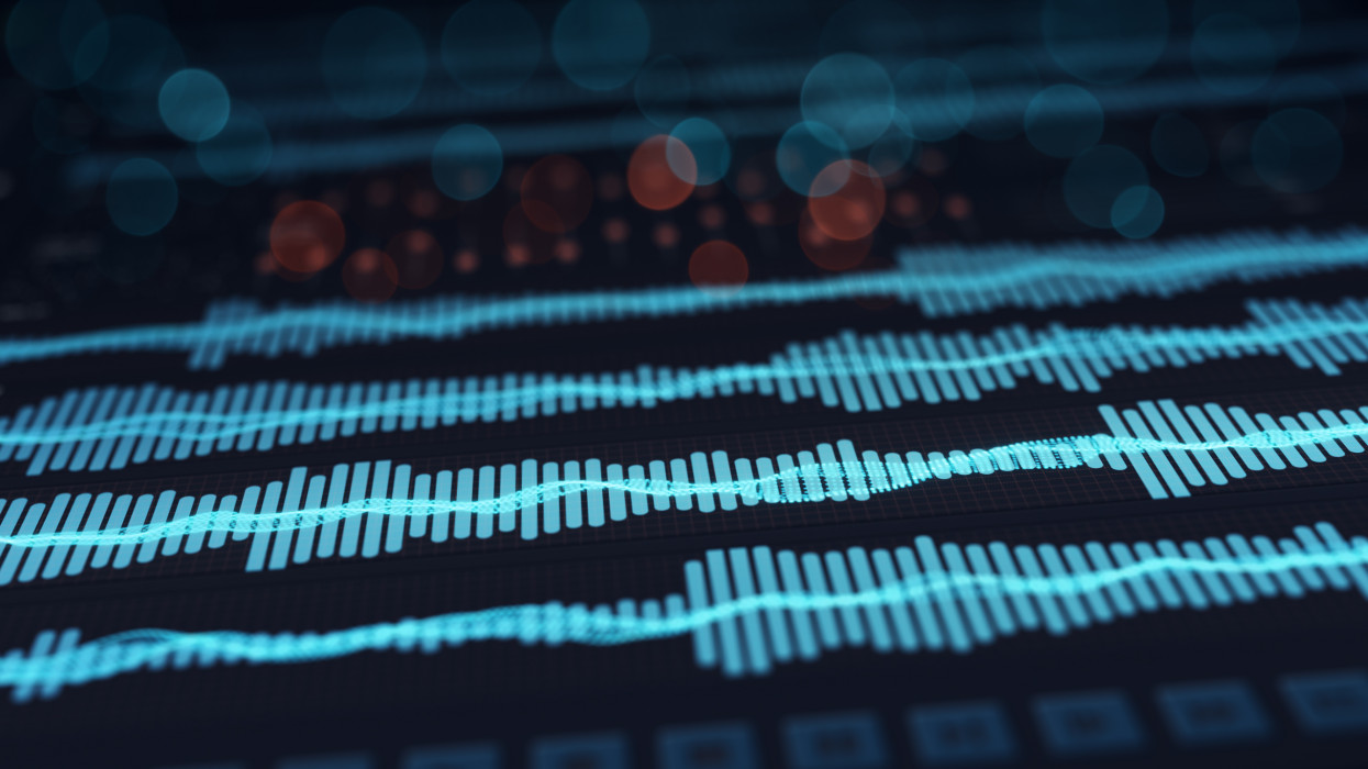 Digital audio waves on screen. Computer designed abstract technology rendering with DOF