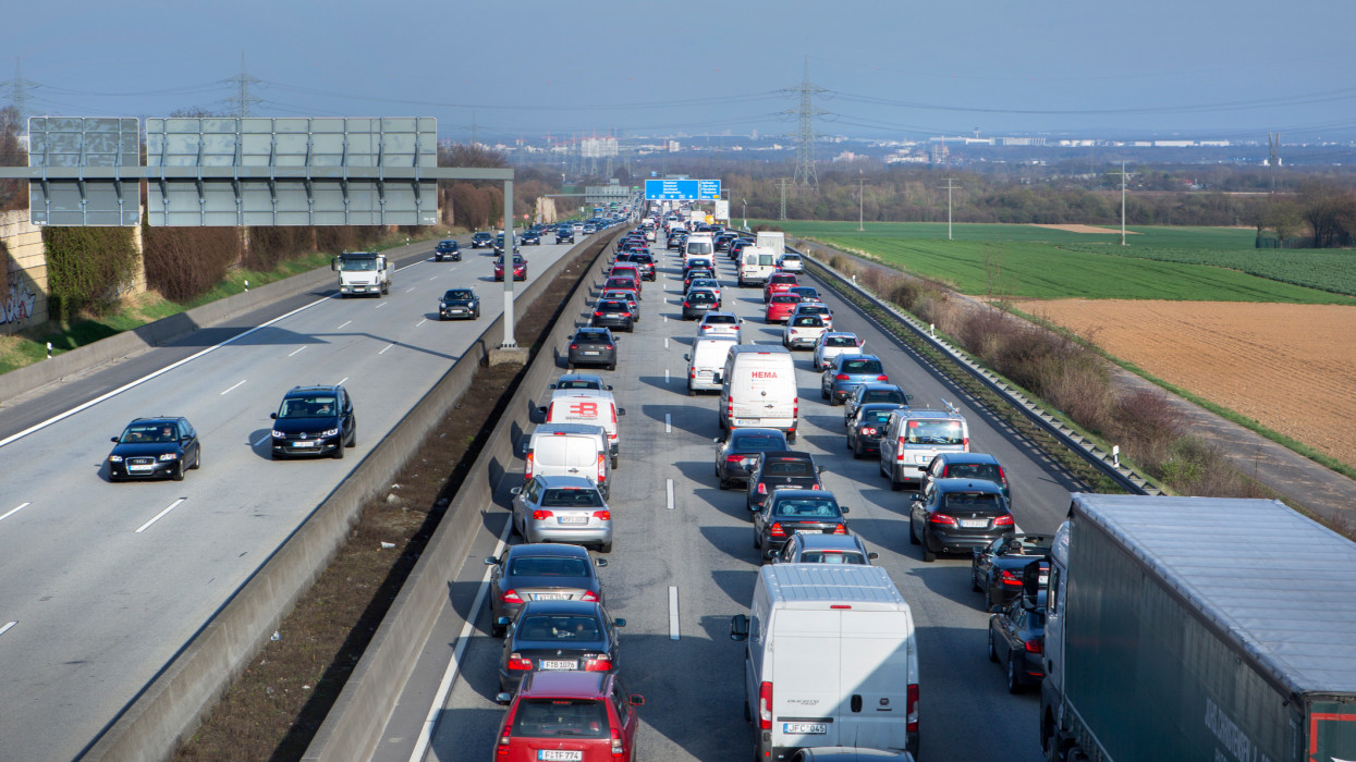 Hofheim, Germany - March 24, 2017: Traffic jam on german Autobahn A 66 nearby Wiesbadener Kreuz - many road users, cars and trucks. The Bundesautobahn 66 (abbreviated as BAB 66 or A 66) is an autobahn in Germany that links the cities of Fulda and Wiesbaden to the city of Frankfurt in the Rhein-Main area. View from above