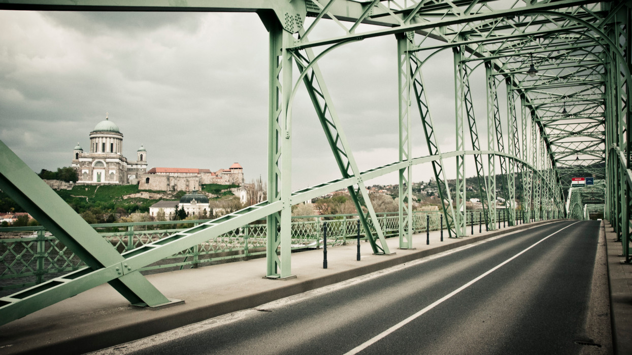 Photograph of the MÃ¡ria ValÃ©ria bridge, which is connecting Esztergom (in Hungary) with the city of Sturovo in Slovakia. The famous bridge is made of steel. It was rebuilt in 2001 with the support of the European Union. It is called in Hungarian MÃ¡ria ValÃ©ria hÃ­d and in Slovak language most MÃ¡rie ValÃ©rie.In the background, on the Hungarian side of the Danube river is the famous cathedral : Esztergom Basilica. It is the largest church in Hungary.Esztergom was the capital of Hungary from the 10th till the 13th century.This photograph was taken in spring 2011 during a journey by bicycle across Europe, Middle-East and Asia.