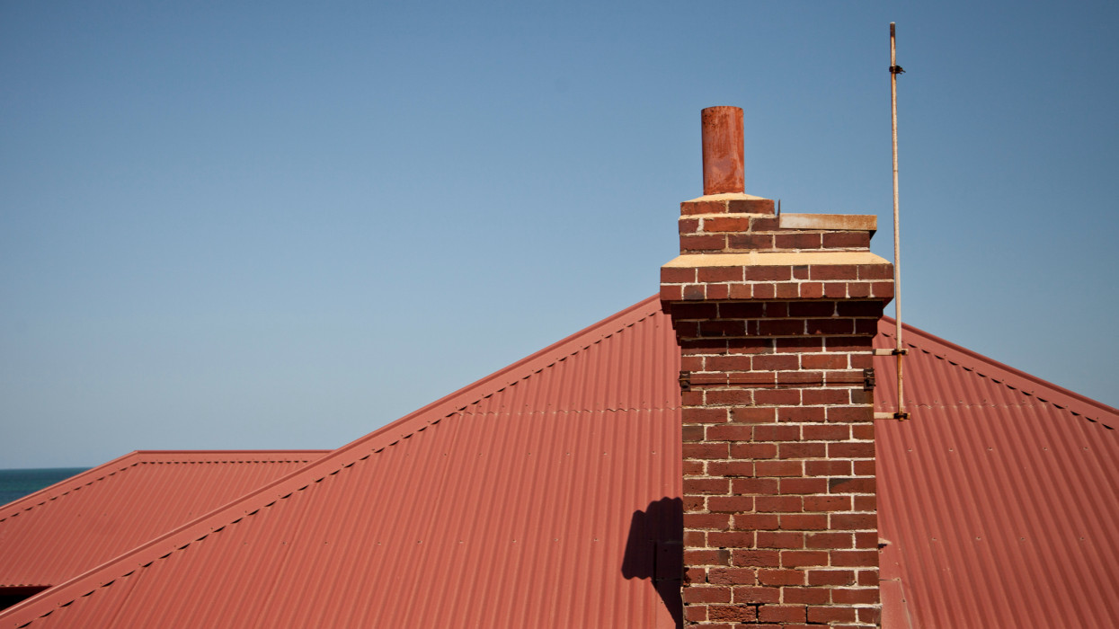 Close-up of chimney on a rooftop.