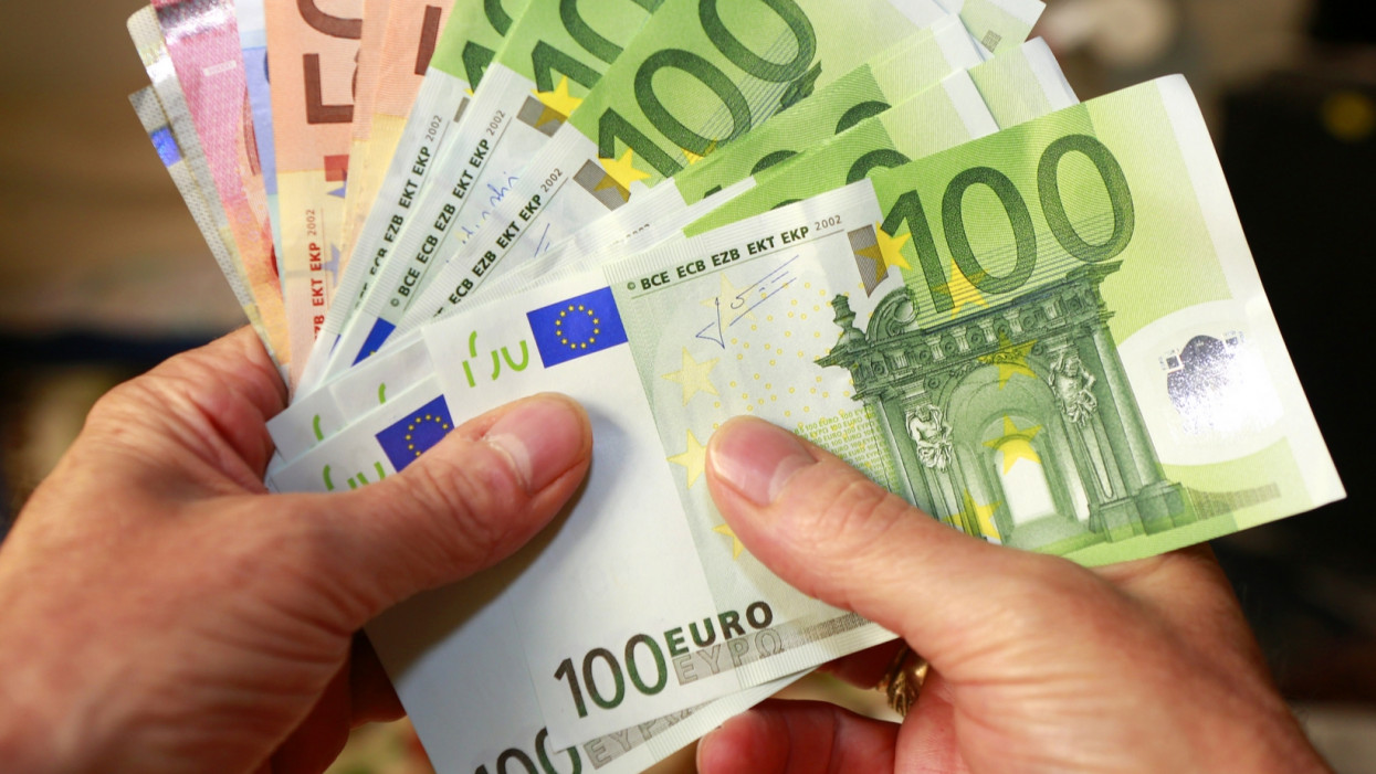 a handful of euros bills