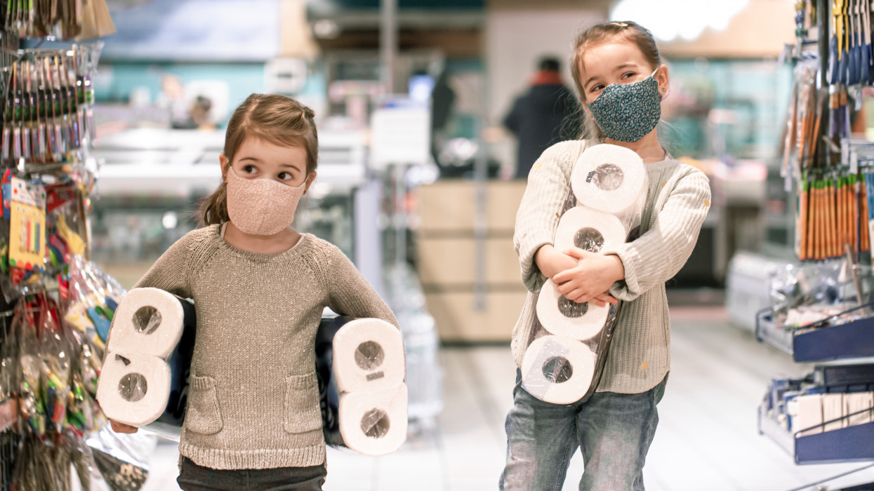 Children shopping at the supermarket during the pandemic . COVID-19 outbreak. Epidemic of virus covid.