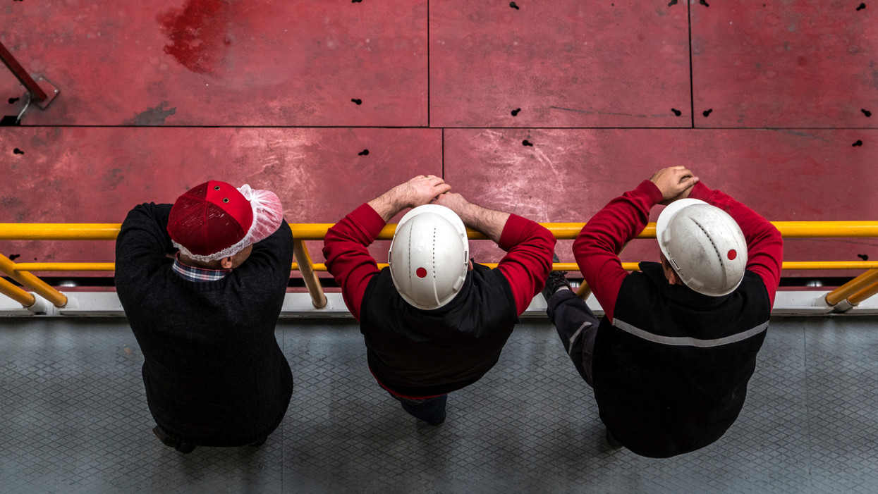 Group of workers in aluminum plant, High angle view. Image taken in daylight with a Sony A7Rii (42 megapixels) and developed from raw.. This pictures were taken in Asas Aluminium Factory in Turkey with a special permission together with property release.