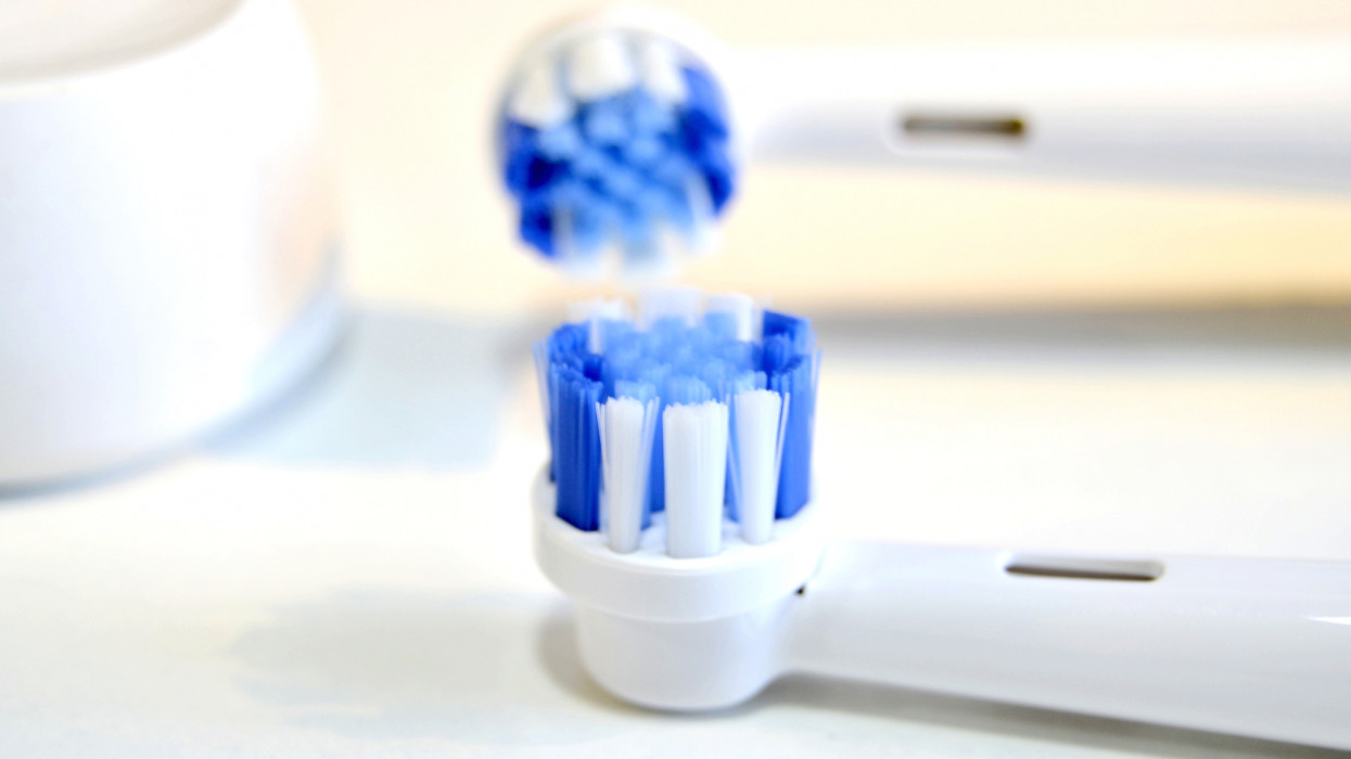 Electric toothbrush on white background