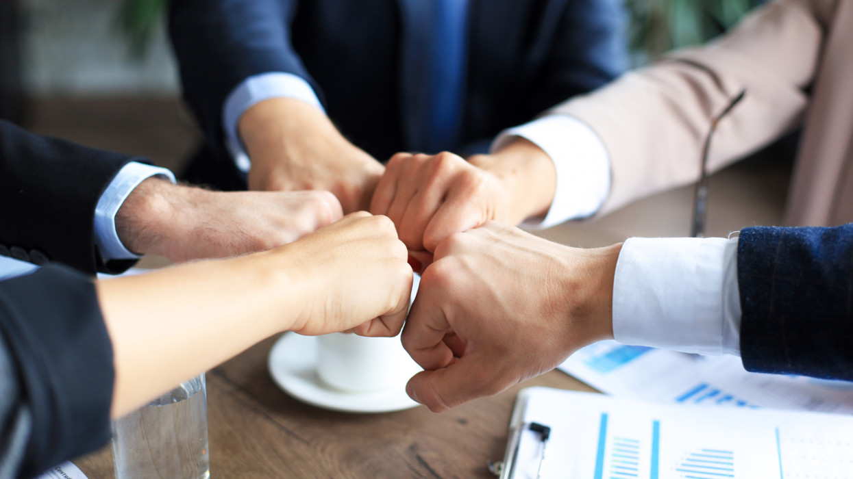 Business people teamwork stacking hand together concept hangshake deal