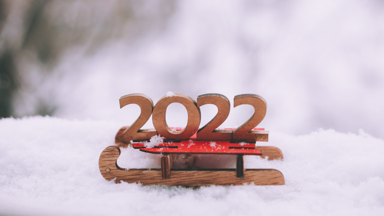 Number 2022 against winter snow background. Happy New Year 2022 concept.