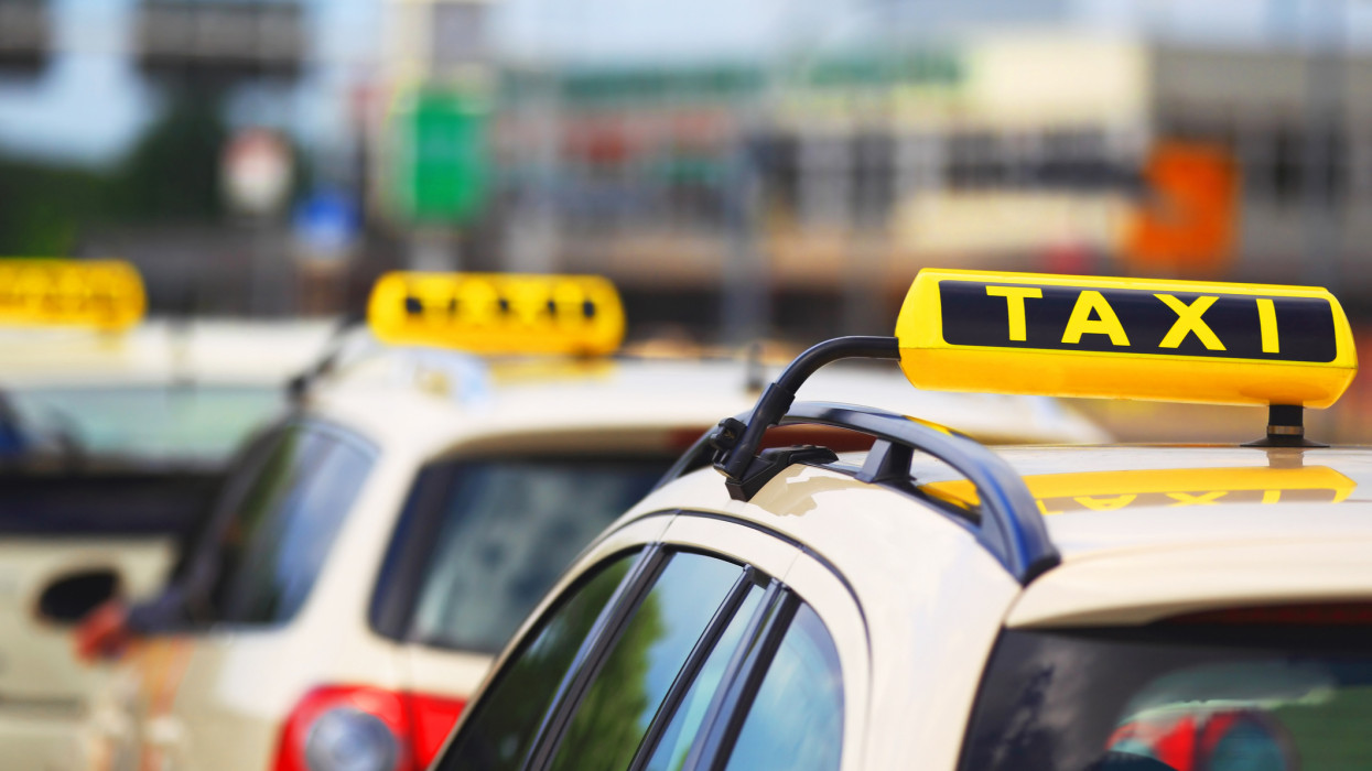Taxi signs - cars waiting for passenger