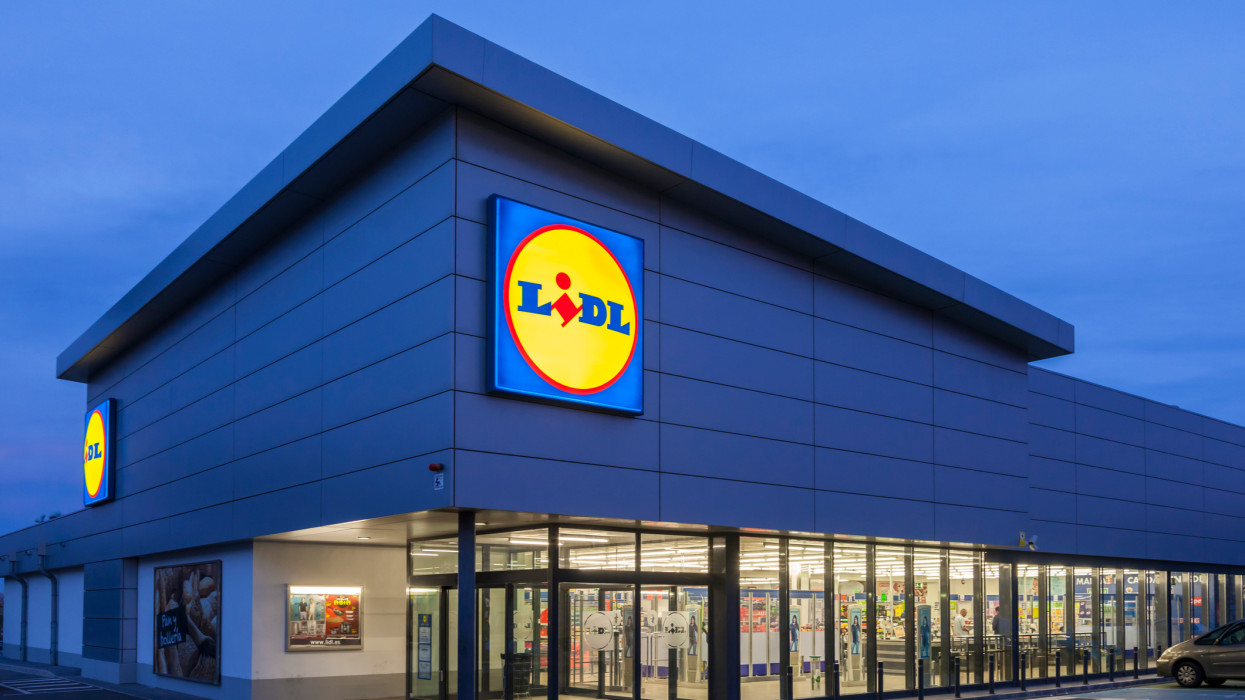 Cartagena, Spain - May 17, 2017: New Lidl supermarket building illuminated at dusk. Lidl is german discount supermarkets chain based in Neckarsulm, Germany
