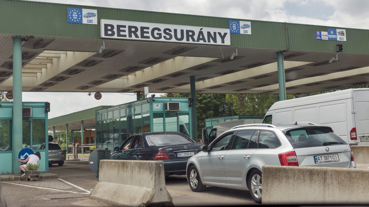 BEREGSURANY, HUNGARY - JULY 08, 2019: Cars stopped on customs checkpoint of Hungarian-Ukrainian state border between Beregsurany, Hungary and Berehove, Ukraine.