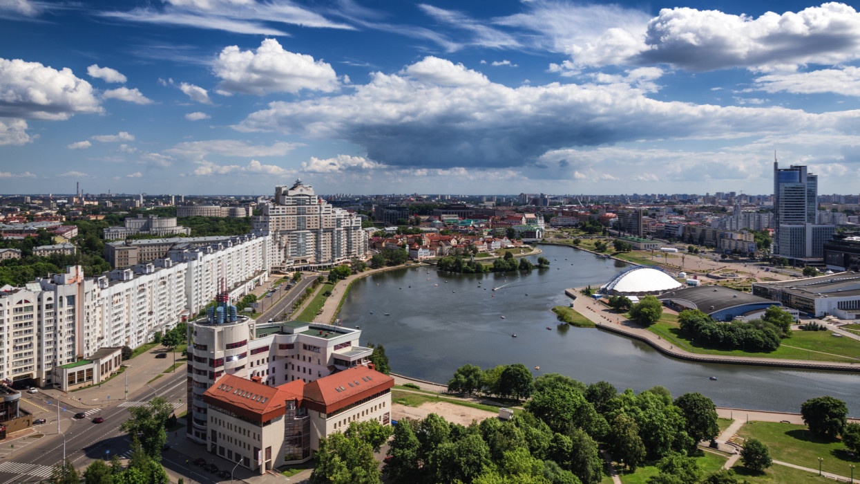 Sunny cloudscape over Minsk downtown and bay of Svisloch river from high observation deck belarus