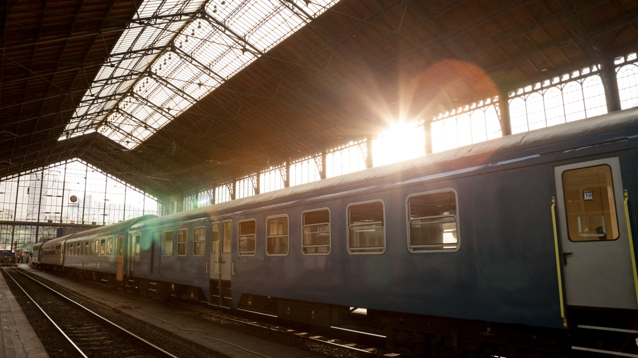 Picture of an incoming train at Nyugati train station, Budapest, Hungary, during a summer sunset