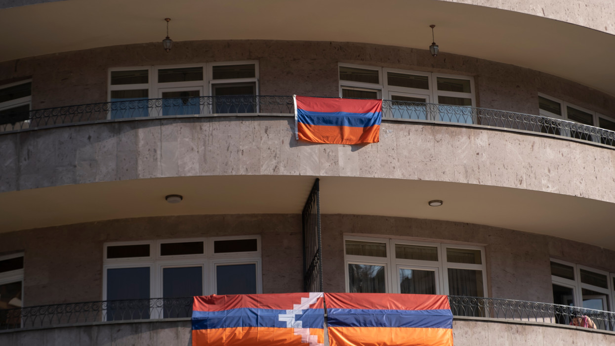 Flag of Nagorno-Karabakh known also as the Artsakh Republic and the flag of Armenia hanged in a building in the city of Yerevan capital of Armenia