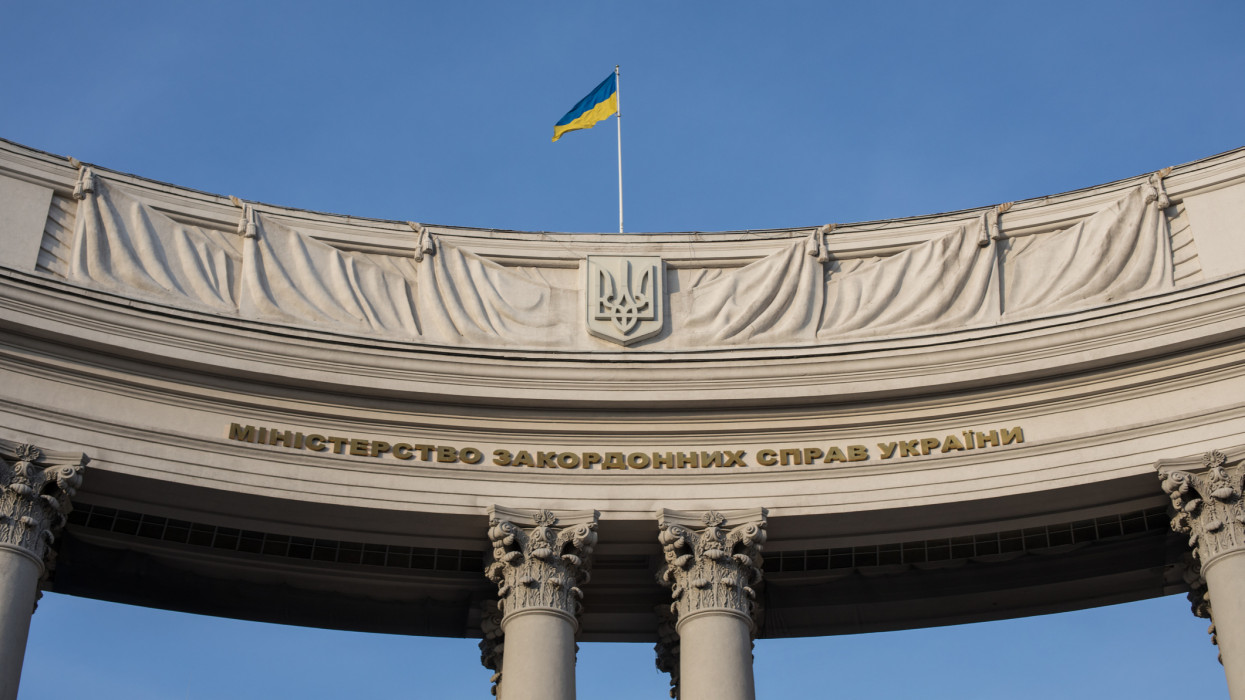 The Ukrainian flag flying from a curved government building in the centre of Kyiv.