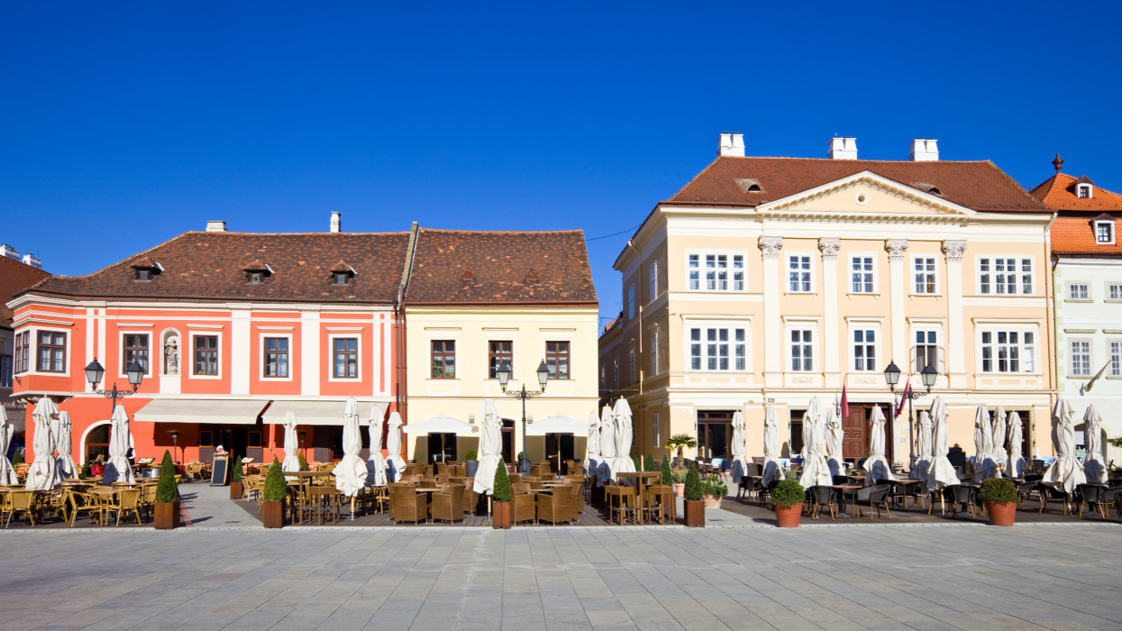 Szechenyi Square with restaurants in downtown Gyor, Hungary
