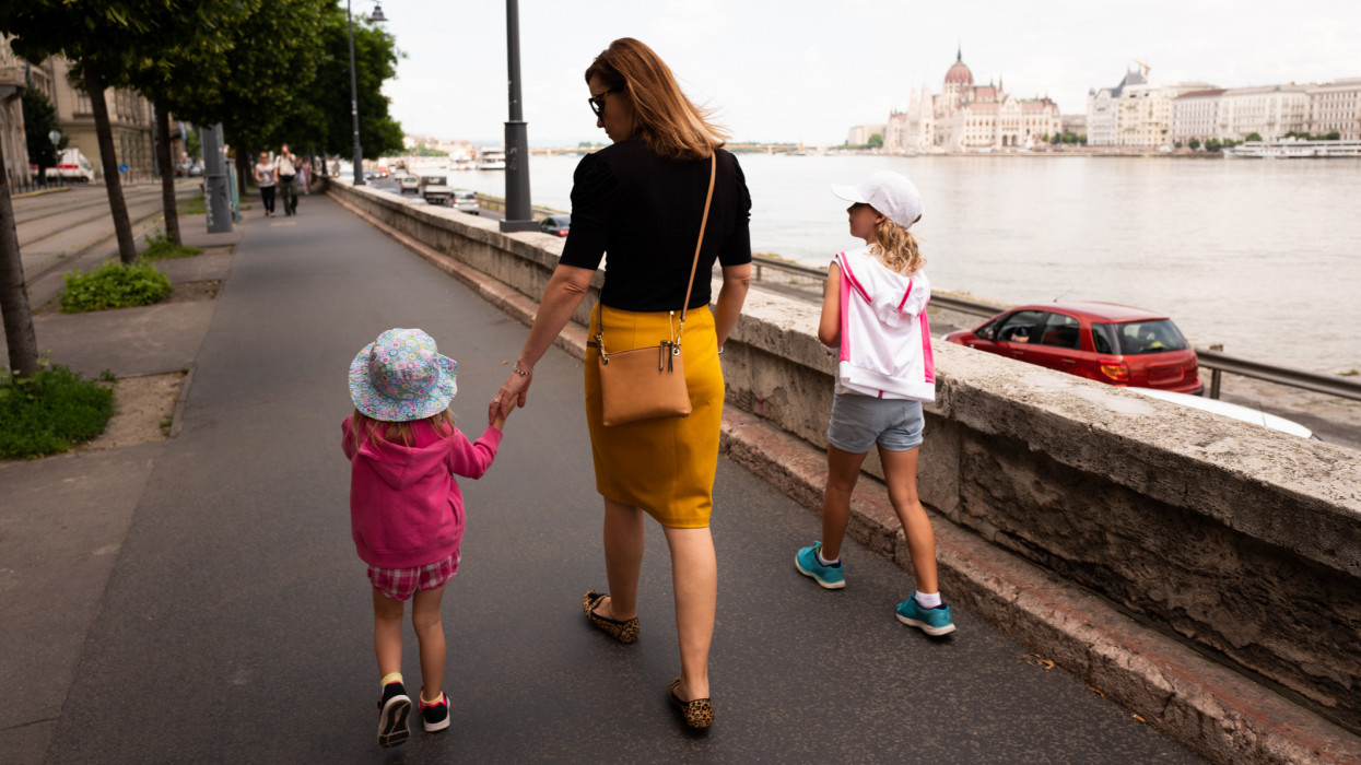 Mother with two children walking on vacation in Budapest, Hungary, Europe