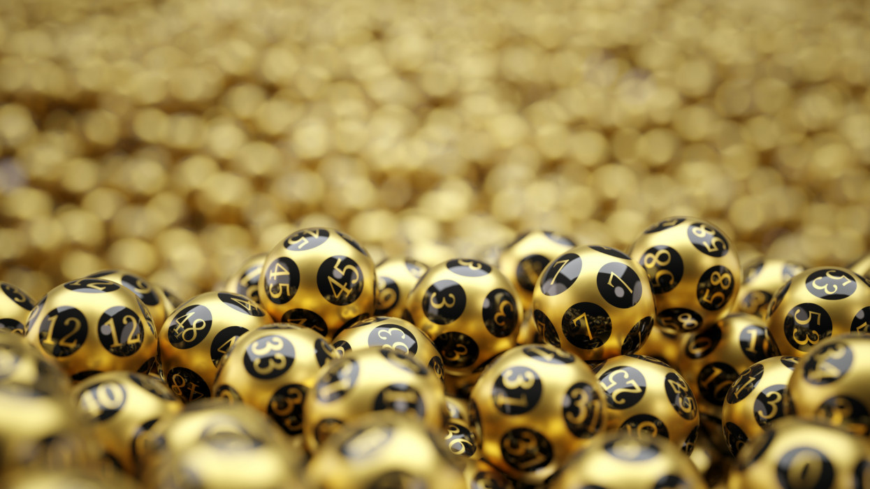 golden lottery balls covered ground with bokeh on background. 3D illustration with copy space. suitable for lottery, bingo and luck themes.