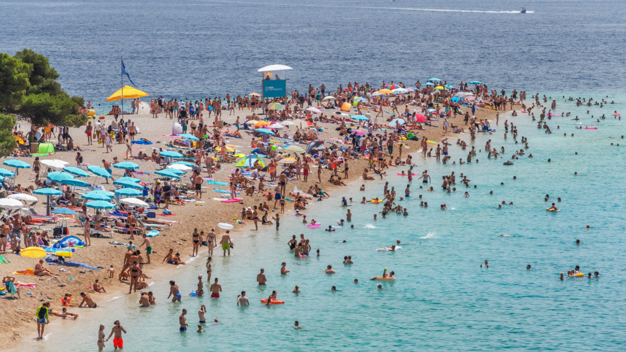 Crowds of people on Golden Cape beach. Golden Cape is the most famous beach in Croatia located on Brac island.