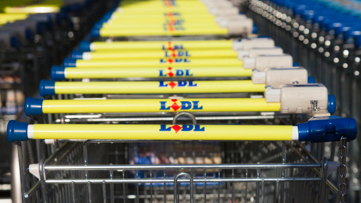 Burg, Germany - November 13, 2016: Shopping carts of the german supermarket chain, Lidl stands together in a row. Lidl is a German global discount supermarket chain, based in Neckarsulm, Germany.