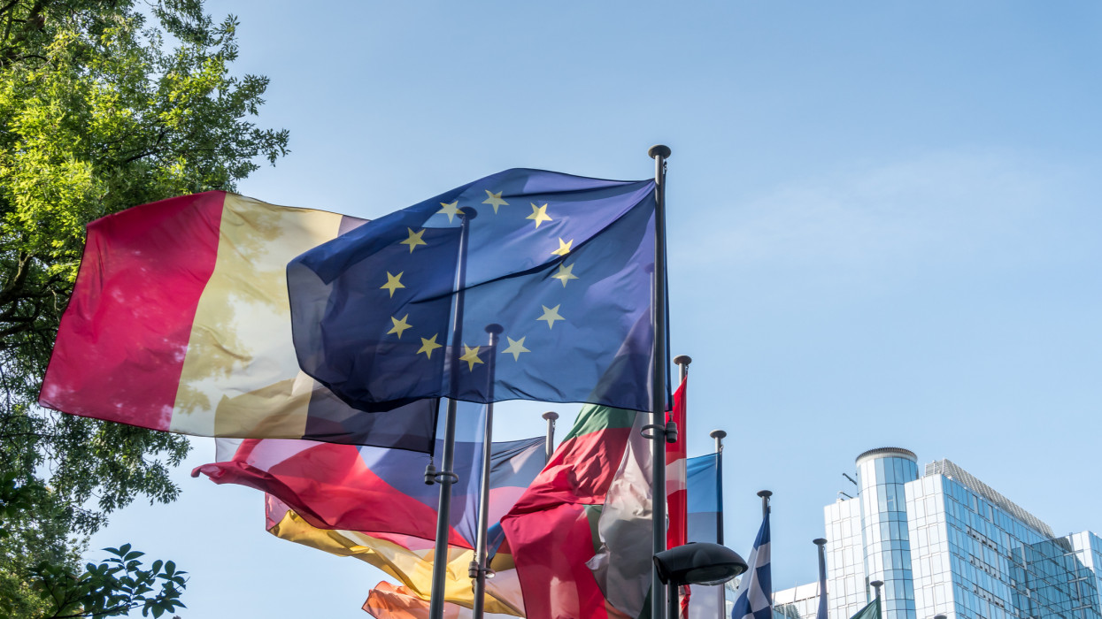 European national flags in front of European Parliament building in Brussels, Belgium.