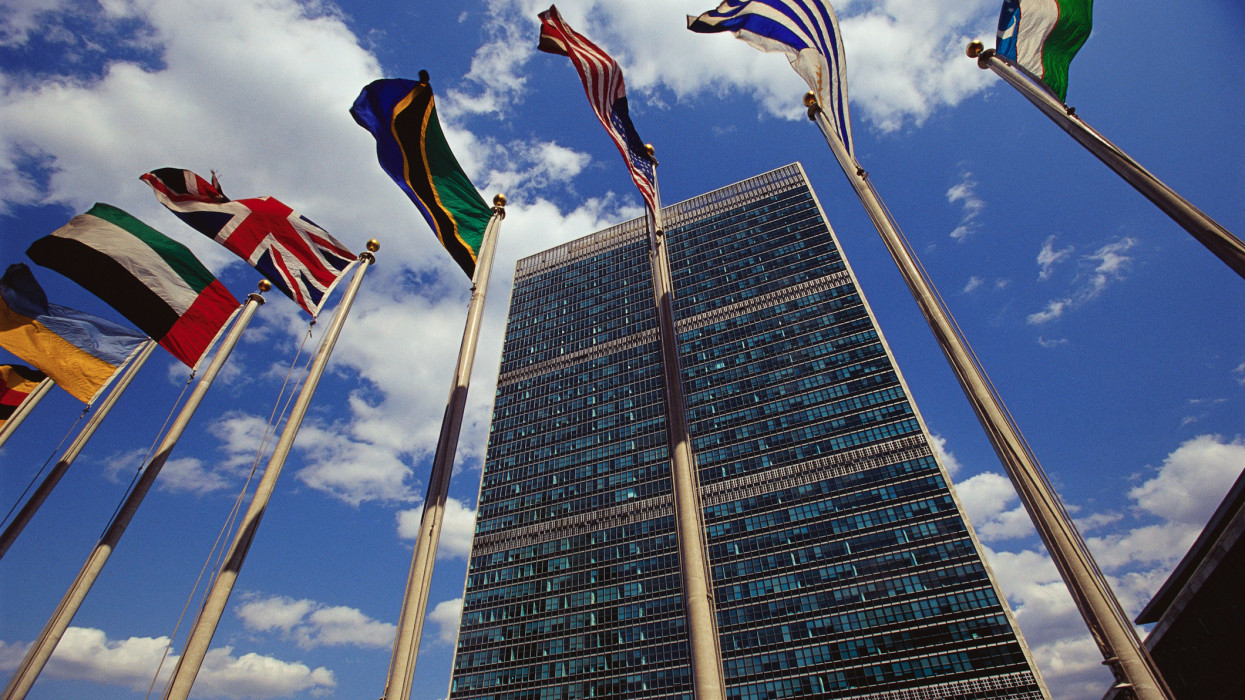Flags fly outside the General Secretariat Building at the United Nations Headquarters.
