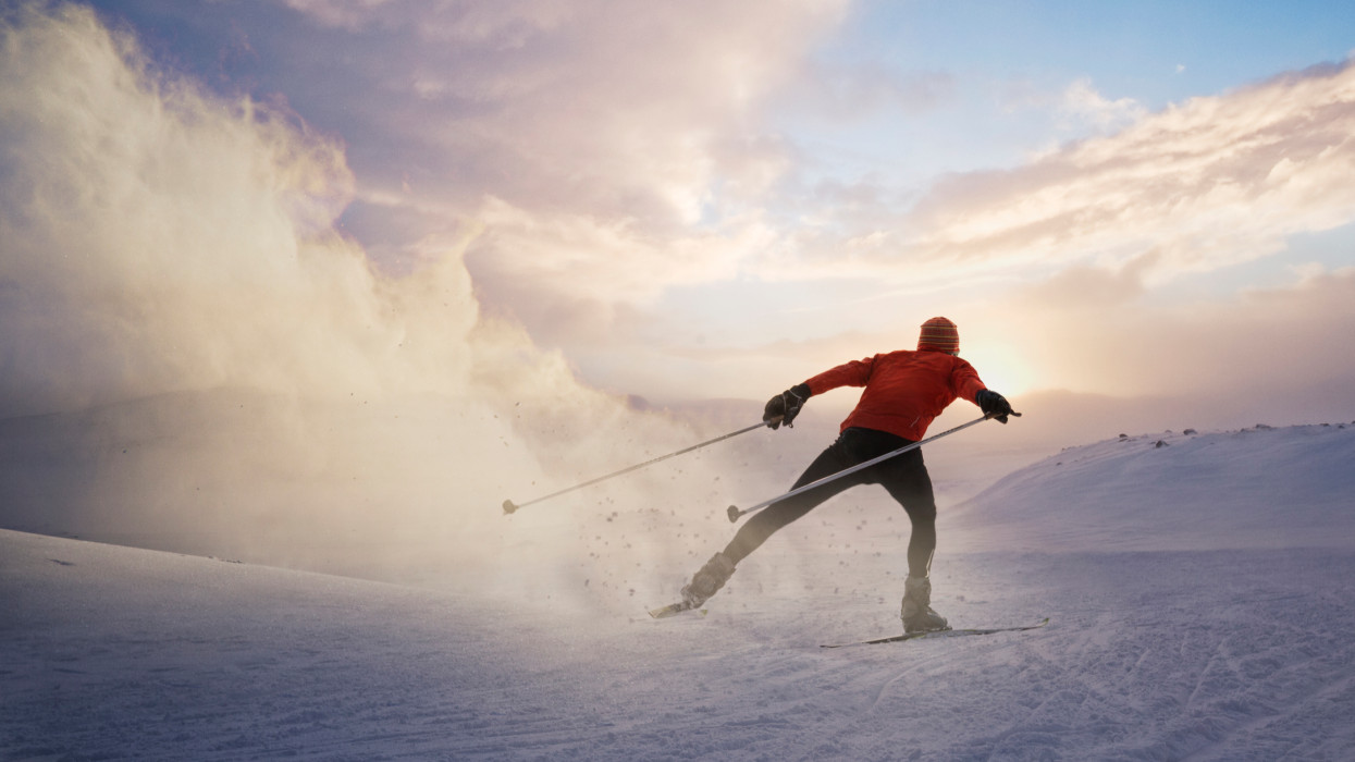 a cross country skier in nice form going across the Hardangervidda plateau in Norway