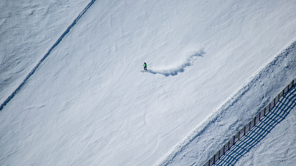 An aerial view of a man skiing on the mountain snow hungary matra epleny