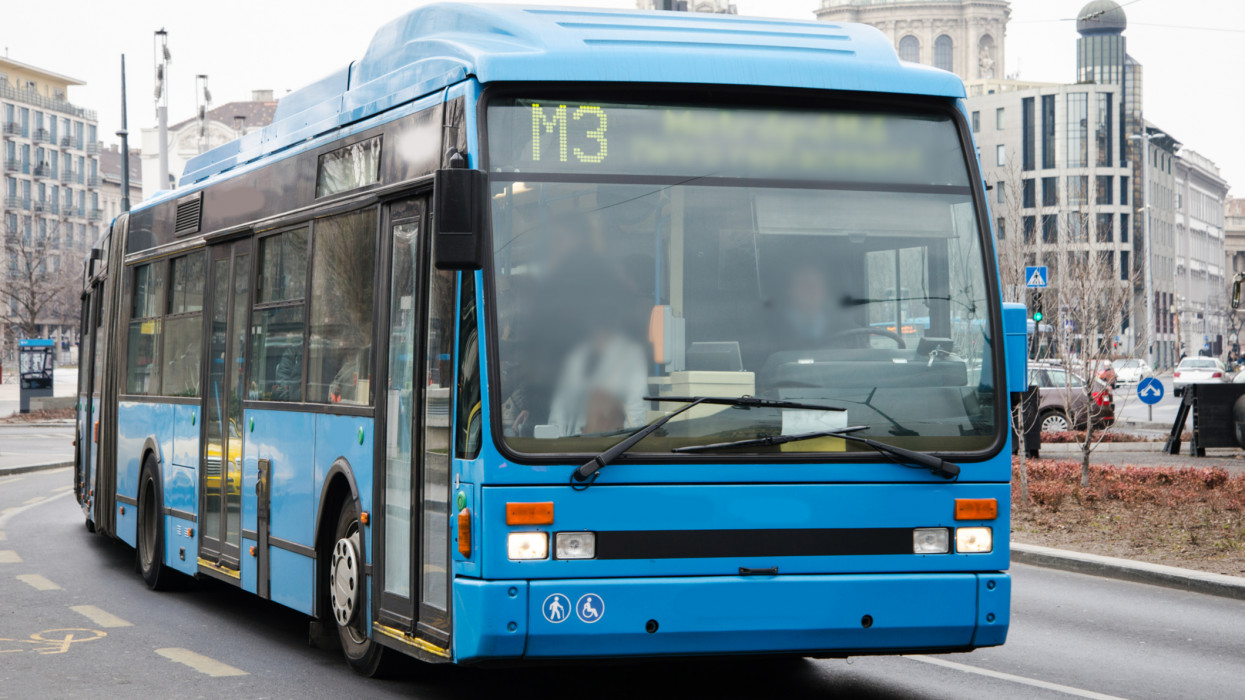 A blue city bus in Budapest, Hungary