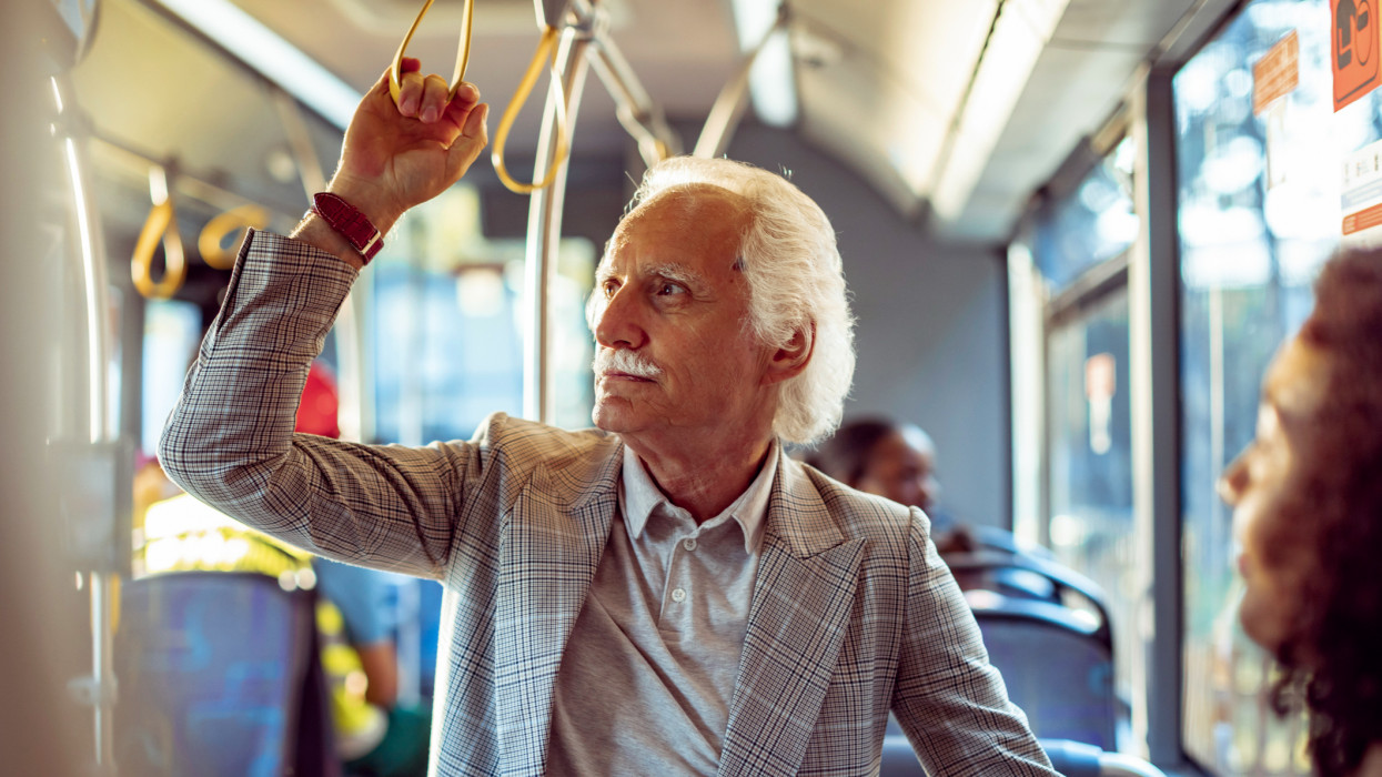 Close up of a senior couple riding in a bus