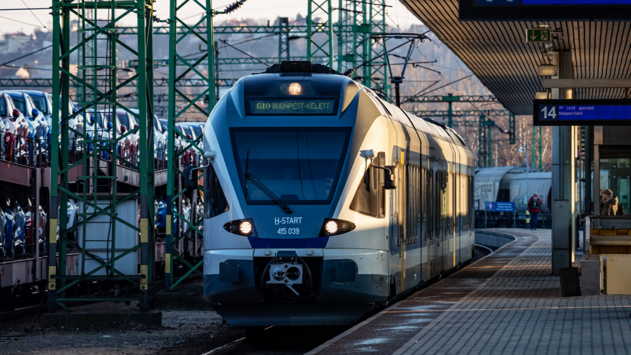 Budapest, Hungary - February 28, 2021: MAV Hungarian Railways passenger train with Stadler FLIRT 415 039 multiple unit trainset arrival at Budapest Kelenfold railway train station.
