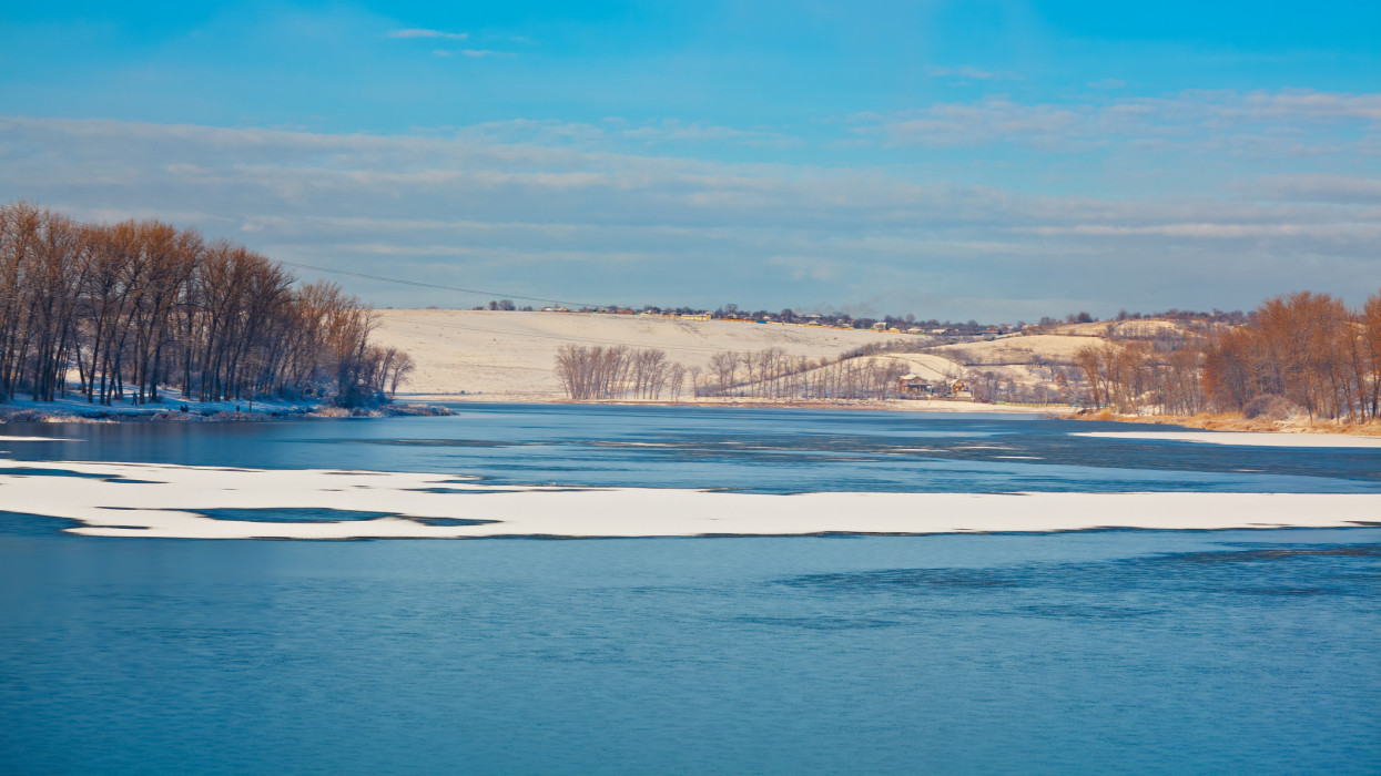 Winter landscape on Dumbrava lake and countryside of Iasi county, Romania.