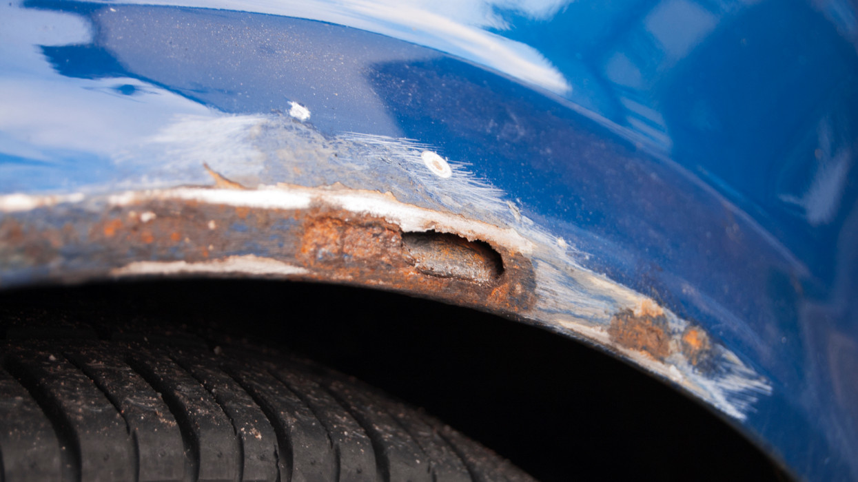 In the United Kingdom, despite the cold weather, motorists are too lazy to mount proper winter tires. Consequently, the roads, in winter and icy conditions, are extensively sprayed with grit salt. Motorists pay then the toll when all the salt, sprayed around the wheels, corrodes the car. In the photo, an extensive rust damage is visible, after the rust has been abraded away, before painting over.