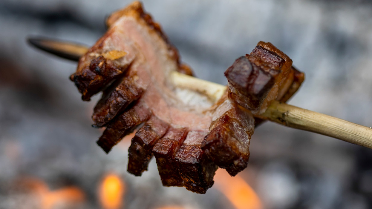 Bacon on skewer roasted at fire