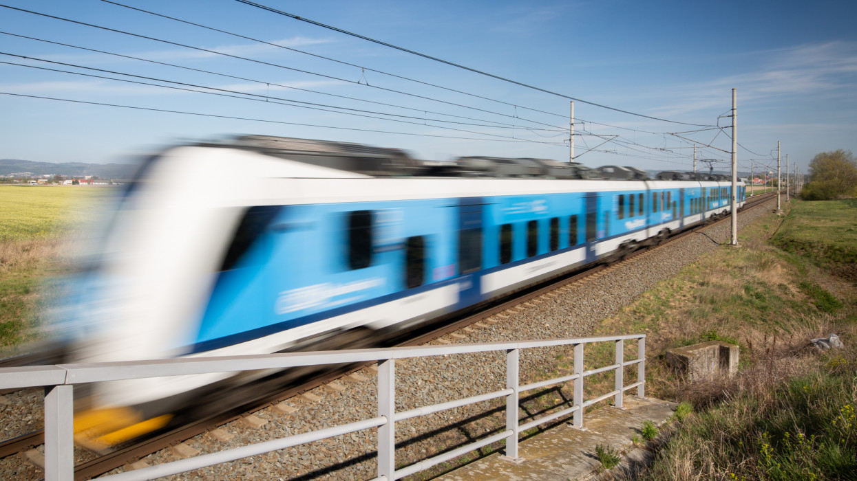Public transport, Blurred train passing through the countryside