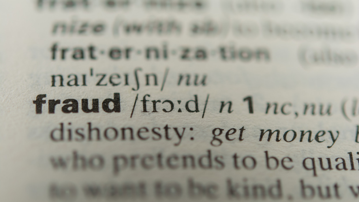 Definition of the word fraud, close up