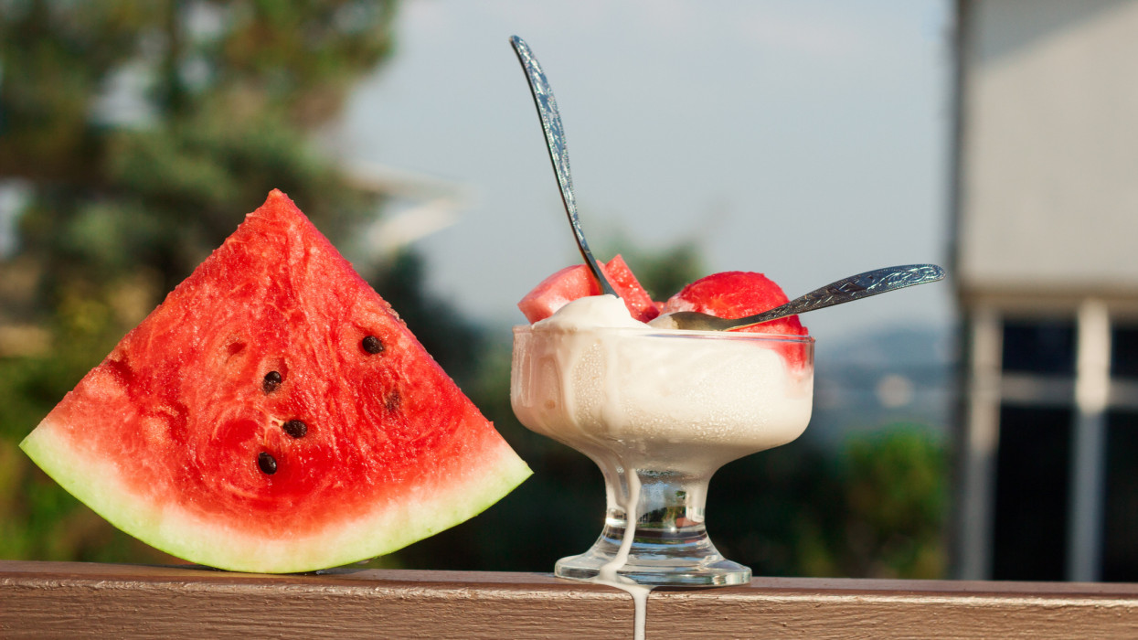 vanilla ice cream served with watermelon slices, cold summer dessert on the terrace hot