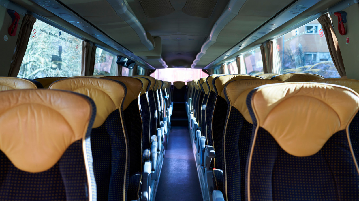 Inside a bus, empty seats after passengers arrive at the destination after their road trip.