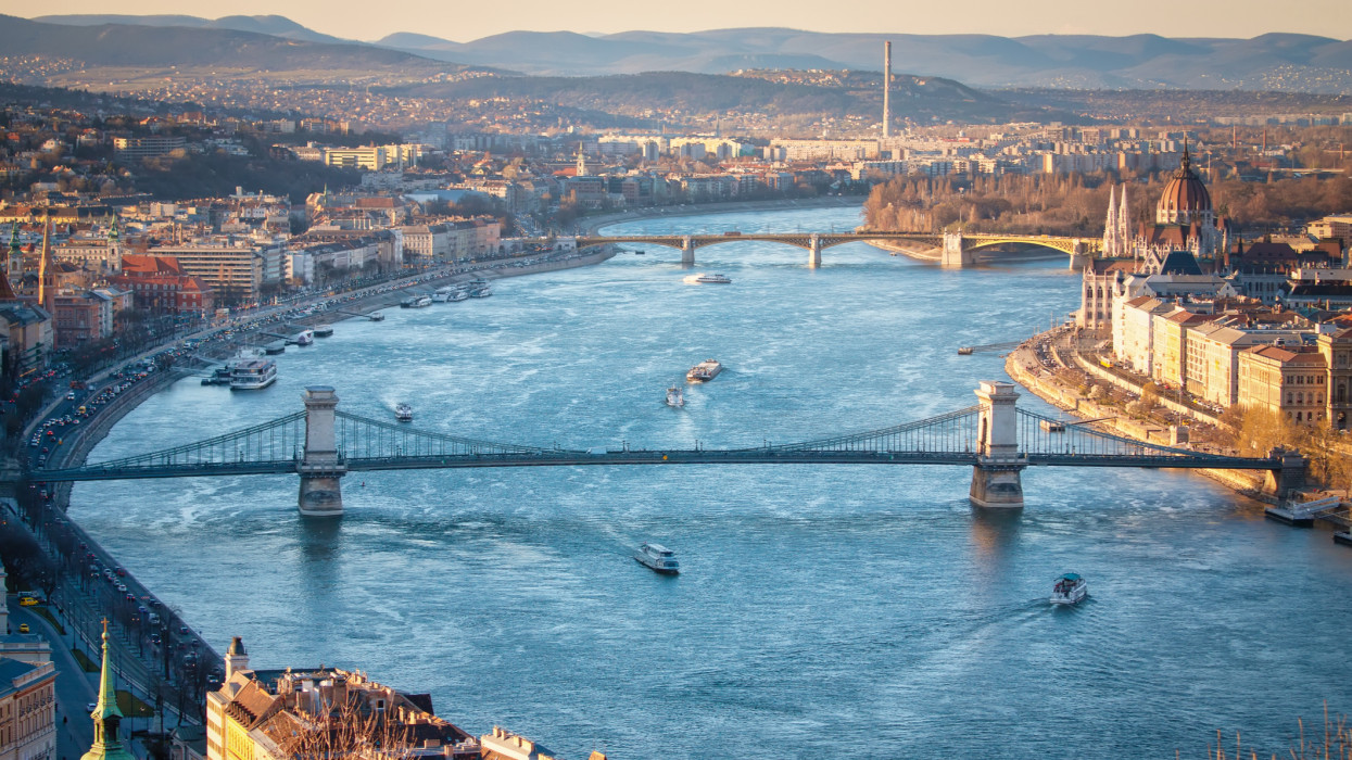 This image was captured from GellÃ©rt Hill located at Budapest, capital city of Hungary. The river in picture is famous Danube river, appears beautiful blue under sunlight.