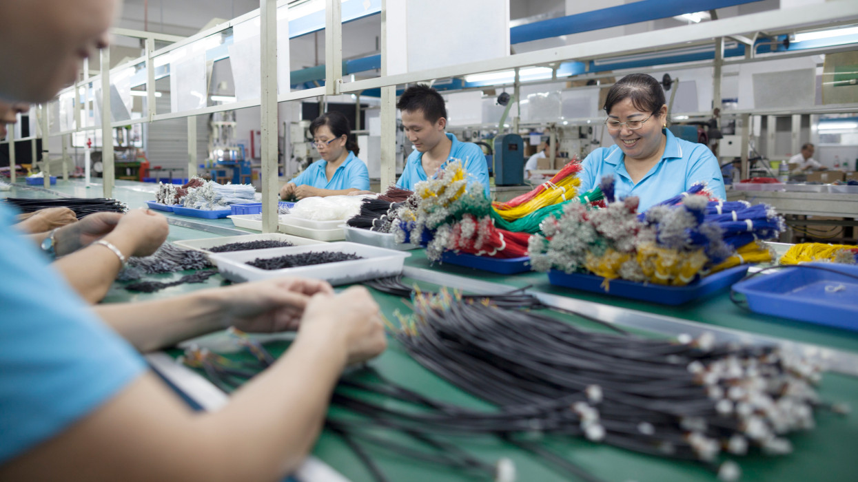Workers at an electronics factory in Dongguan, China