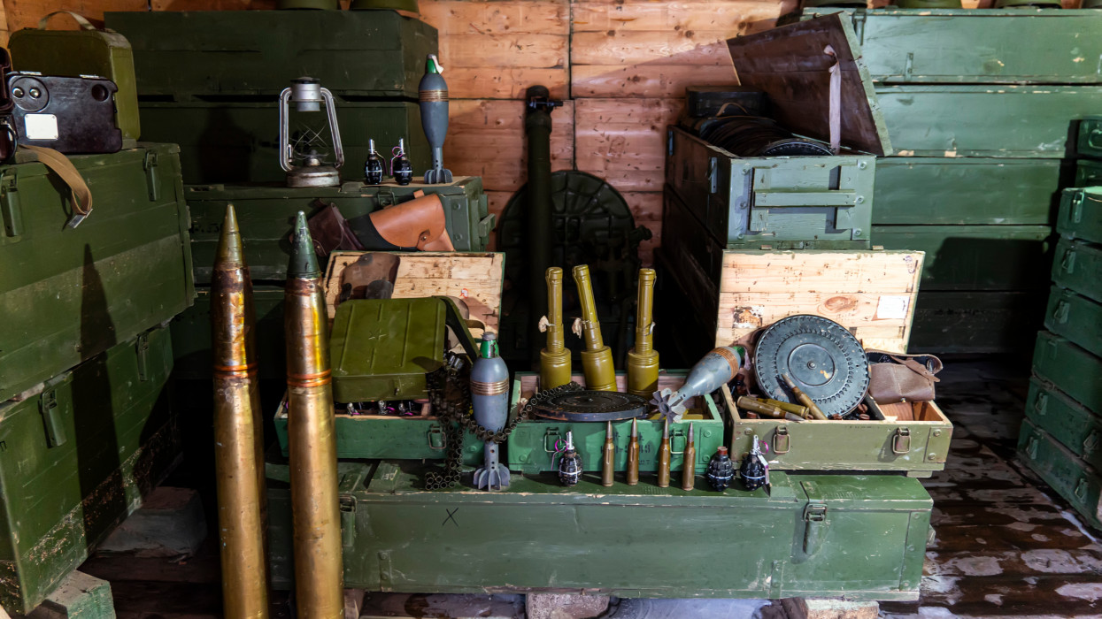 various types of ammunition and military equipment in the basement.
