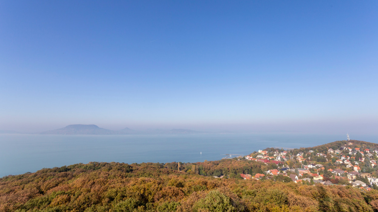 View of the foggy Balaton from the lookout tower of Fonyod with the Badacsony mountain in the background on an autumn day.