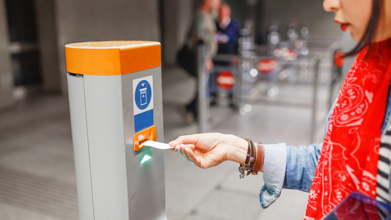 Validate a ticket at a validation machine for access to the underground city transport system
